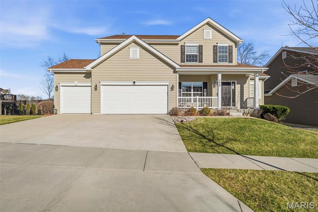 Backing to woods on a premium lot in sought-after Fienup Farms, this 1.5-story home offers over 4500 sq ft of finished living space, including a beautifully finished walkout lower level. Built in 2020, the home features an open floor plan with a soaring two-story great room, main-floor primary suite, and upgraded kitchen with quartz countertops, marble subway tile backsplash, under-cabinet lighting, walk-in pantry, and expanded cabinetry. Enjoy peaceful sunrise views from the newer 16' x 20' composite deck overlooking the fenced backyard and wooded common ground. The outdoor living space continues with a flagstone patio, retaining wall seating, decorative lighting, professional landscaping, irrigation system, and landscape lighting. The walkout lower level adds approximately 1,400 sq ft and includes a wine cellar with custom racks, hot stone steam sauna, projector and speaker wiring, large recreation area, full bath, and private bedroom suite with walk-in closet. Additional features include custom closet systems, crown molding, Tesla EV charger, WiFi-enabled garage door opener, and a new roof installed in December 2025. Fienup Farms is known for its resort-style amenities, including a 26-acre lake, pickleball courts, playgrounds, and miles of walking trails. All of this in the award-winning Rockwood School District, just minutes from Chesterfield Valley, Highway 40/64, and the future downtown Chesterfield.