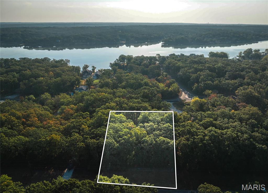 Wooded 0.24-acre lot located in the desirable Indian Hills Lake community. This property offers a natural setting with mature trees, providing privacy and flexibility for your future build or recreational use.

Utilities are available nearby, making development more convenient. Enjoy access to community amenities, including the lake, common areas, and outdoor recreation opportunities.

Whether you’re looking to build or invest, this lot offers a great opportunity to own property in a well-established lake community.