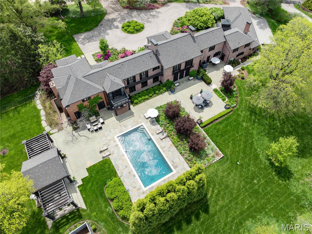 New Price! Quintessential Huntleigh Estate. A resplendent residence with a storied past, built as August Busch Sr.'s Bridle Spur Hunt Club, meticulously transformed through remodels, renovations, additions and elegant World Class landscaping, now a modern home with nearly every sought amenity. 5 bedrooms, 8 baths, and 10,000SF+ living space,  a perfect balance of finest finishes, convenience, efficiency and  functionality. This is a rare opportunity to own a bespoke and opulent home that is turn key ready. Ideal for sophisticated entertainment, large scale events or fundraisers to intimate dinners al fresco under the stars in the poolside pergola. 3 lavish equestrian acres with terraces, patios and a fountained pool. The 2-story Great Room is breathtaking architectural art. Several living spaces throughout. An elaborate kitchen features marble island, Wolf and Subzero appliances. 5 bedrooms, all en-suite. Fully finished walk-out lower level. A new 4-car garage addition completes the property.