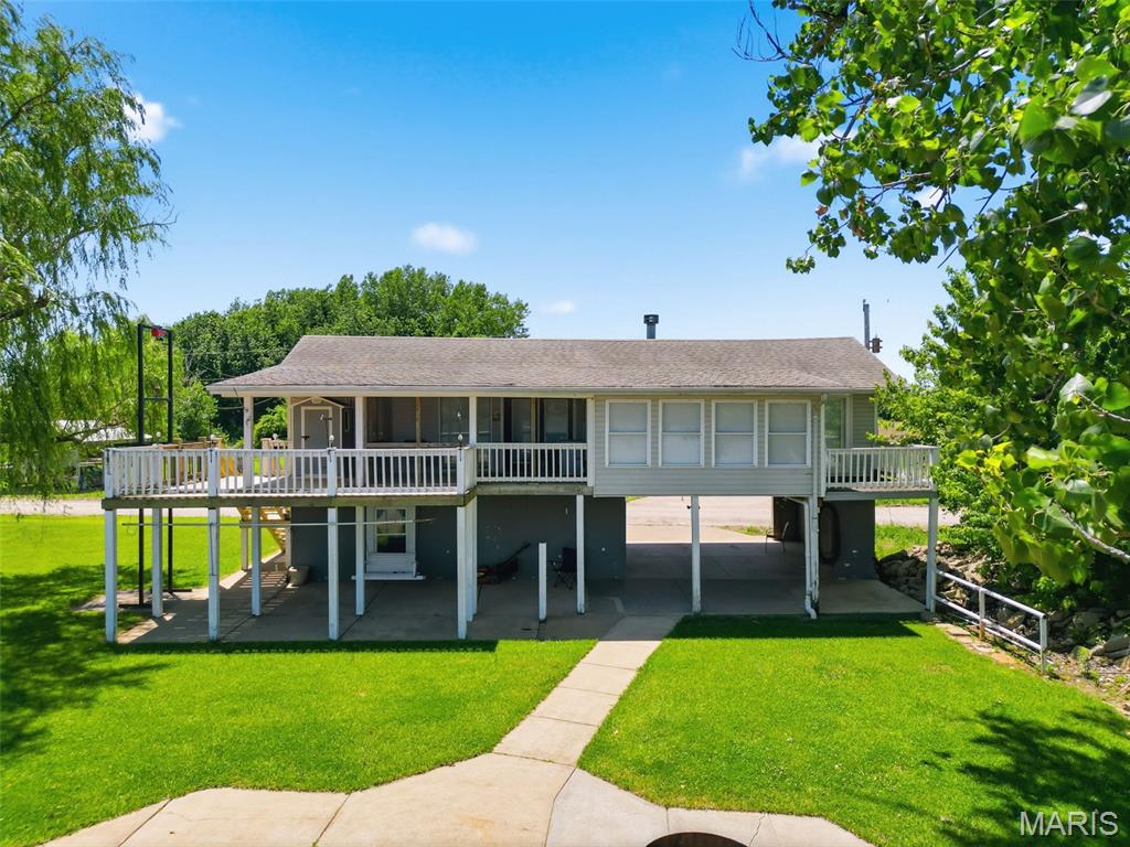 Wonderful riverfront home on the Mississippi River! This 2-bedroom, 1-bath property features a wood-burning fireplace, breakfast bar in the kitchen, and beautiful river views. The roof is approximately 8–9 years old, the steps are brand new, and the exterior elevator has a new motor. Enjoy two front decks: a private deck off the bedroom and a larger, partially screened-in deck overlooking the Mighty Mississippi. The property also offers a large patio with a fire pit, plus a ground-level area that can be used as a carport or shaded outdoor living space. A storage area is also located on the ground level. This property may be purchased with the lot across the road. That property is 0.35 acres and includes a 42' x 60' shed with a 14' door, 9' door, concrete floors, and 200-amp service and loft.