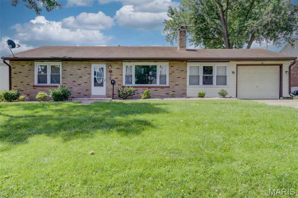 Classic Florissant ranch with great bones and genuine charm. Hardwood floors, wood-burning fireplace, 2 bedrooms, 1.5 baths, attached garage, and a big backyard — all on a quiet street in an established neighborhood. The unfinished basement is a blank canvas ready for your vision. Schedule your showing today!