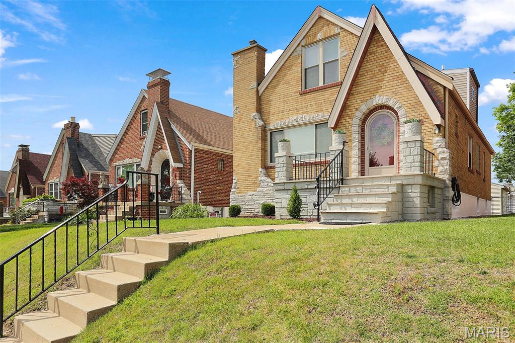Dreaming of a home with character, great neighbors, and a location that makes it easy to get outside and enjoy life? This charming gingerbread has all that and more. Tucked on a quiet, tree-lined street, it's the kind of block where people actually know each other's names. And with Tilles Park just a short walk away, you'll have pickleball, tennis courts, walking paths, green space, and a splash pad practically in your backyard. Inside, you'll find gorgeous original hardwood floors, a cozy vintage fireplace, and all the charm that makes older homes so special. The formal dining room is ready for everything from holiday dinners to board game nights and brunches with friends. The updated kitchen is bright, cheerful, and functional—the kind of space that makes cooking feel a little less like a chore. Two bedrooms and an updated full bath are conveniently located on the main floor. Upstairs, you'll find two more bedrooms, a second full bath, and some seriously cool knotty pine paneling that brings all the vintage vibes. Need extra space? The finished basement delivers with a huge rec room that's perfect for movie marathons, a home office, workout space, playroom—or some combination of all four. There's also a third full bath, laundry area, and plenty of storage. Out back, the yard offers room for gardening, grilling, or simply enjoying your morning coffee, and the garage is the icing on the cake. If you've been waiting for a home that feels welcoming from the moment you pull up, this just might be the one. Skip the Zillow rabbit hole and reach out to me--the listing agent--directly for more information or to schedule a tour.
