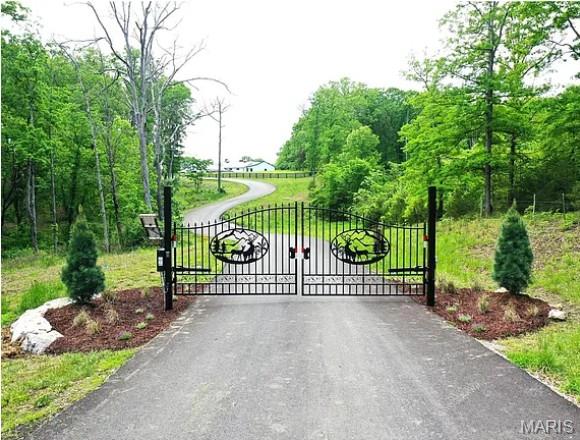 Discover a rare opportunity to own a private 5-acre homesite in an exclusive gated community in beautiful St. Charles County. Tucked away on Hidden Sanctuary, this exceptional property offers the perfect blend of seclusion and convenience, just 15 minutes from shopping, grocery, and everyday essentials. Bring your own builder and create the custom home you’ve always envisioned within the highly sought-after Francis Howell School District. Far enough removed from the hustle of daily life, every day here feels like a vacation surrounded by peace, privacy, and nature. An adjoining 5-acre lot is also available, offering the rare chance to expand to 10 acres—don’t miss this extraordinary opportunity to secure your dream homesite before it’s gone.