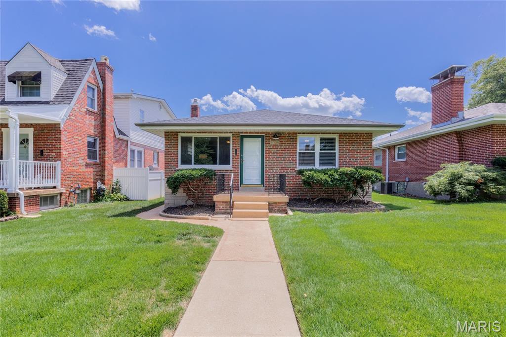 OPEN HOUSE SUNDAY 7/26 1-3! This adorable brick bungalow is located in the heart of Lindenwood Park on one of the best streets in the city-- surrounded by large lots, mature trees and tons of character! Walking distance to so many south city favorites like Trattoria Marcella, Blue Print Coffee, Donut Drive In, Ted Drewes, Lindenwood Park, and so much more! You'll love the open living/ dining room and original hardwood floors! The updated kitchen features warm cabinets, SS appliances and lots of natural light. Two good sized bedrooms and a full bath fill the rest of the main level. Out back is an amazing screened in porch-- perfect for enjoying morning coffee the rest of summer and all of fall. The basement is a blank slate with plenty of room for extra living space + storage. A large fenced in yard, big patio and garage make this place the whole package!