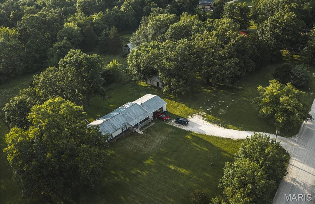 Enjoy peaceful country living with this charming 2-bedroom, 1-bath home on Abrolat Road in Warren County. Located on a quiet gravel road, this property offers a comfortable place to call home with plenty of potential. The home features a one-car attached garage and a small barn, providing additional storage or space. Whether you're looking for a full-time residence, a weekend getaway, or an investment property, this home is worth a look. For added opportunity, the seller is also offering the option to purchase the five other properties up the road, making it easy to expand your investment portfolio or create a larger country retreat.