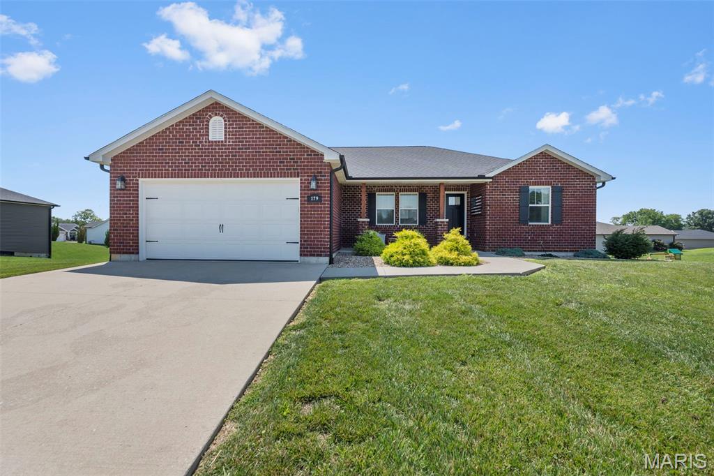 Welcome to 179 Fraser Ridge in the beautiful Savers Farm Subdivision! Built in 2018, this full-brick ranch offers over 2,400 square feet of finished living space with 4 bedrooms and 3 full bathrooms. Step inside to an open-concept layout with a desirable split-bedroom floor plan. The spacious primary suite features a walk-in closet and a stunning tiled walk-in shower. The kitchen is designed for both everyday living and entertaining with granite countertops, a large island, and a gas burner range. The walk-out lower level adds an additional 1,000 finished square feet, complete with a large family room, fourth bedroom, and third full bath. Situated on a .41-acre lot with no homes directly behind, you'll enjoy added privacy and peaceful views. Conveniently located near Interstate 55 with an easy commute to Procter & Gamble and all that Jackson has to offer!