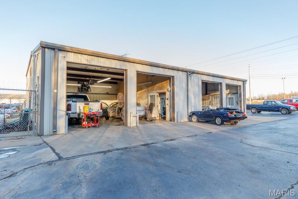 Positioned along the historic corridor of U.S. Route 66 and benefiting from strong exposure near Interstate 44, this versatile 1,800 square foot commercial shop building presents a rare opportunity for business owners, investors, or entrepreneurs seeking a highly visible and easily accessible location. The property’s prime placement along one of the most recognizable highways in America ensures consistent traffic flow and outstanding visibility, making it an ideal setting for a wide range of commercial operations. Whether you envision an automotive service center, equipment repair shop, contractor headquarters, retail showroom, or service-based business, this property offers the flexibility and exposure necessary to help a business thrive. The building itself is thoughtfully designed with functionality and efficiency in mind. Spanning approximately 1,800 square feet, the shop is configured with four spacious garage bays that allow for multiple workstations, maximizing productivity and workflow. Each bay provides ample space for vehicles, equipment, or storage, giving business owners the flexibility to operate several projects simultaneously. Overall, this 1,800 square foot shop building represents an outstanding opportunity to secure a high-visibility commercial property in a well-traveled location. With four garage bays, a large asphalt parking area, excellent Route 66 frontage, and convenient interstate accessibility, the property offers the ideal foundation for a successful business operation. Whether you are launching a new venture, relocating an existing company, or investing in a property with strong commercial potential, this shop provides the visibility, accessibility, and versatility needed to support long-term success.