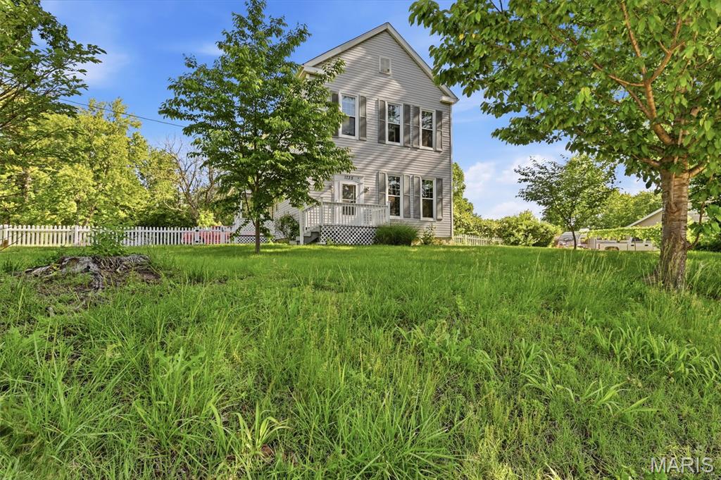 Welcome home to 1735 Redman! This rare, historic two-story treasure has 4 bedrooms and 2.5 bathrooms, complete with crown molding, 12-foot ceilings, hardwood, luxury vinyl flooring and amazing natural light. The main floor offers lots of charm and character with a large kitchen, two family/living rooms and a grand staircase leading to the upper level. Upstairs you'll find the primary bedroom w/full bathroom. Three bedrooms, a large full bathroom and a small, landing area round out the 2nd floor. Head down the back staircase into the kitchen, or out onto the side porch for another access/exit point. The large 2 car over-sized garage offers plenty of storage, a workshop and stairs down to the unfinished basement. The property sits on a spacious yard, has plenty of parking and tons of potential to make it your own. Close to schools, restaurants and stores. Don't miss this one. Book a showing today!