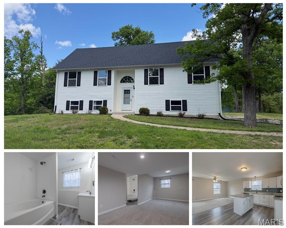 Price Improvement! Days on market are a DRAG - but this is a lovely home, could you be the right buyer? BEAUTIFUL split level home on almost 1/2 acre with a tuck under oversize 2 car garage!  The main level has a dining area that is open to the kitchen and living area. Kitchen has stainless appliances, glass backsplash and quartz countertops. Large deck off the back with access from the dining area. The 3 bedrooms on the main level are good sized with neutral colors. Primary bedroom has an ensuite with shower. The lower level is mostly finished with a 4th bedroom or could be used as flex space, it has an attached ensuite. Laundry room is here along with access to the oversized garage. On a large lot with some low matainance landscaping. Fantastic location, Wright City school district and public utilities. 15 minutes from Wentzville, Warrenton and Troy. Even closer to Indian Camp Creek and park. Be sure to set an appointment to see this in person - you will probably love it!