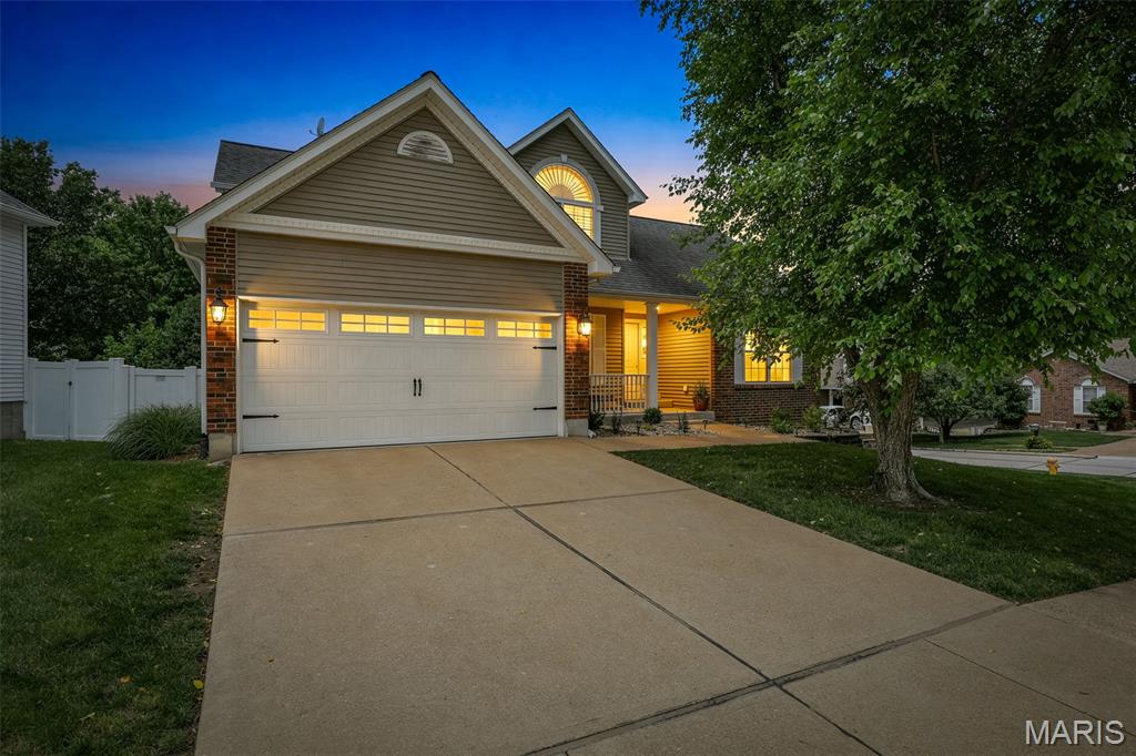 Welcome home to this stunning, 1.5-story gem in the highly sought-after Lindbergh School District and City of Fenton! Immaculately maintained and move-in ready, this 3-bedroom, 3.5-bath home offers an exceptional blend of style, comfort, and functionality. A dramatic 2-story entry welcomes you inside, complemented by a charming sitting room perfect for a home office, hobby nook, or formal living space. The spacious main-floor primary suite is a true retreat, featuring a vaulted ceiling, large walk-in closet, and private bath with a soaking tub, separate shower, and plenty of space to unwind at the end of the day. The soaring 2-story great room with fireplace creates an inviting gathering space, while the eat-in kitchen showcases beautiful cabinetry, wood flooring, granite countertops, matching appliances, and a huge pantry. Step outside to the maintenance-free, pergola-covered deck, perfect for morning coffee, outdoor dining, and entertaining, with stairs leading to the backyard. The main level is rounded out with a powder room, laundry room, and additional storage closet.
Upstairs, a spacious loft overlooks the great room and is accompanied by two  sized bedrooms and a full bath. The finished walkout lower level is truly a showstopper, featuring a large TV/rec area, walk-up bar, poker/game room, full bath, and abundant storage space. A spacious 2-car garage provides plenty of room for vehicles, tools, and storage. Conveniently located near parks, restaurants, shopping, and everyday amenities, this exceptional home truly has it all—style, space, updates, and a location you'll love!