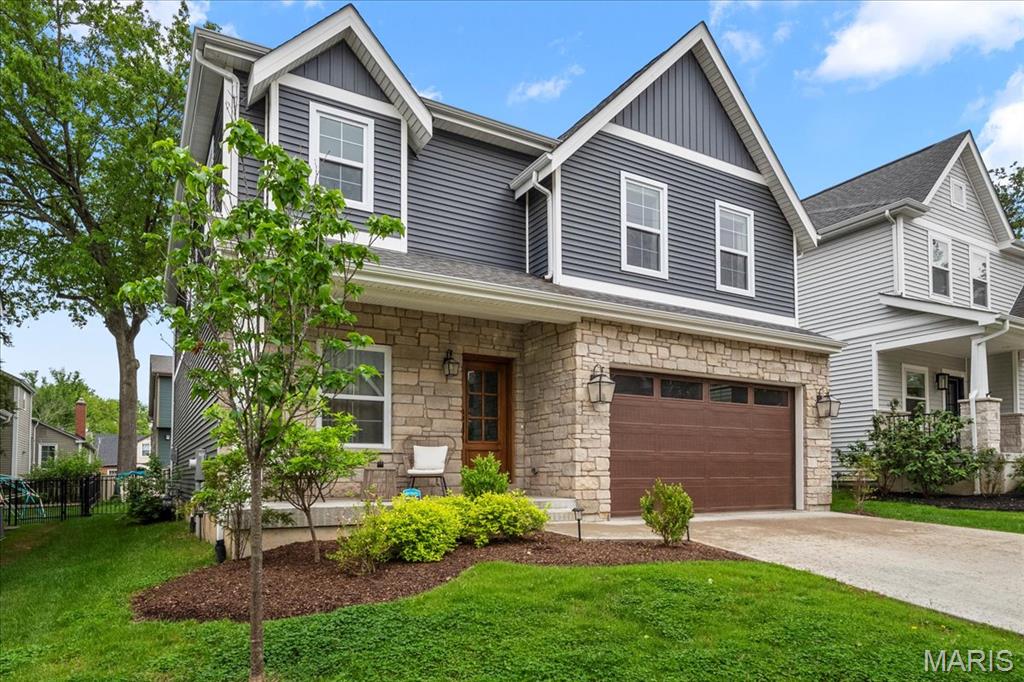 Now available in the Ladue School District: a thoughtfully designed 5-bedroom, 4.5-bath newer construction home with stylish finishes and a functional layout. This 2-story residence features 9’ ceilings, crown molding on both levels, and engineered hardwood floors throughout the main level and primary suite. Designed for entertaining, the open kitchen features quartz countertops, 42” cabinets, a 36” Thermador gas cooktop, stainless KitchenAid appliances, and a large walk-in pantry, while the great room centers around a gas fireplace flanked with built-ins. The primary suite is a true retreat, offering two walk-in closets, a soaking tub, a separate shower, dual vanities, and a coffered ceiling. Upstairs includes three additional bedrooms, two full baths, and a laundry room. The finished lower level provides valuable bonus space, including a rec room, fifth bedroom, and full bath. There’s an oversized mudroom with cubbies, an attached 2-car garage, a new patio, and a fenced yard! Additional Rooms: Mud Room