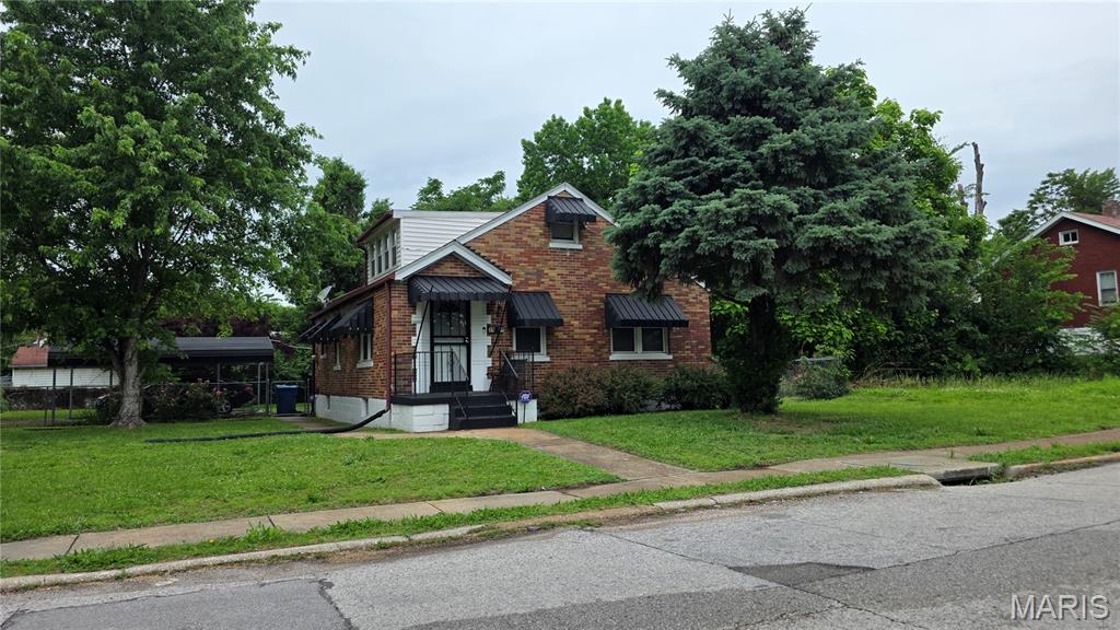 Welcome to this charming classic 1.5-story brick home on a spacious corner lot in Northwoods, a solid foundation ready for your personal touch and equity-building vision. This thoughtfully laid-out residence features two bedrooms and a full bath on the main level, plus two additional bedrooms and another full bath upstairs, giving you flexible living space that works for families, guests, or a home office.
Recent updates provide an excellent head start, including a refreshed kitchen, updated main-level bathroom, brand-new flooring throughout, and a newly upgraded electrical panel for modern peace of mind. Picture your morning coffee on the cozy enclosed porch, relaxing or entertaining in the expansive full basement, or making memories in the generous yard that’s perfect for backyard BBQs, play, and outdoor gatherings. A convenient carport completes the package.
This is a fantastic opportunity to move right in and make this house your own. Buyer to verify schools. Showings by appointment only; please wait for confirmation.