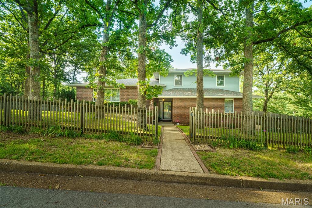 SPREAD OUT & RELAX in this MOVE-IN READY home with spaces for everyone in the family on nearly 1/3 acre lot.  The large, welcoming Entry opens to spacious Living room and Kitchen, gracious separate Dining room, Family Room with gas log fireplace that opens to a large deck, a guest bath, Laundry, and oversized Garage with workbench.  The large Eat-in Kitchen offers loads of cabinet storage and counter space plus a Pantry, a Samsung Induction range, a range hood that is vented to the outside, and an eating bar with room for four!  It opens to a lovely Sunroom overlooking the backyard with mini-split heating and cooling and skylights for year-round outdoor enjoyment in comfort.  The upper level holds the Primary bedroom suite along with two more nicely sized bedrooms and two full baths.  The lower level offers a roomy Recreation room with two closets for games and activity storage, a great Craft / Hobby room with more storage and under cabinet lighting, and a Workshop with workbench, peg board and even more storage!  With walk-out access from the lower level and the deck off the Family room, the back yard is Privacy fenced for a great play area or to hold the family’s pets.  This home also offers an attic fan, water softener, new Heat Pump in 2019 and new roof in 2020!