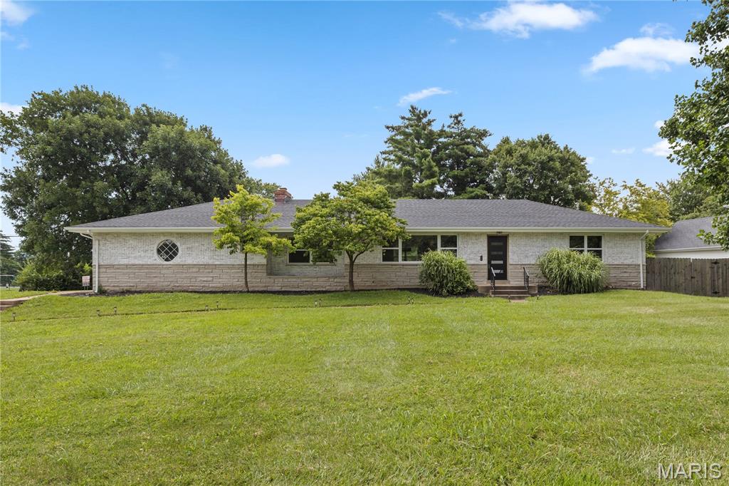 This gorgeous 2300 plus square foot home is located on the border of Ballwin and Manchester in the blue ribbon Parkway school district. Almost every single feature updated. As you approach the corner half acre lot you notice professional landscaping, white washed brick and new roof. Once you enter the front door you immediately note the completely open floor plan, new vinyl plank flooring, custom Wilson lighting plus recessed lighting, two panel doors, and neutral paint pallet. Living room has Shiplap wrapped electric fireplace, and extremely large recently replaced windows. Kitchen is a total refresh with quartz counter tops, breakfast bar, backsplash, energy star stainless appliances including refrigerator, and extra storage shaker cabinets. Two laundry rooms including one off kitchen with mudroom, shelving, and stackable washer and dryer. Split floor plan bedrooms allow privacy for master bedroom. It is located adjacent to upgraded bath with marble floor, shower with frameless door plus porcelain tile surround and all other new fixtures. Second and third bedrooms are larger with double windows in each bedroom and ceiling fans. Larger hall bath is nicely updated as well.  Enormous family room features great entertainment space with electric fireplace and carpet. Of course they were both just replaced. Walk out to the backyard. Garage is oversized with access to back yard when you can spend your evenings on 400 square foot patio with fenced back yard. Roof, HVAC, gas hot water heater, garage door and electrical panel have all been replaced. This lovely gem has many custom features and is a must see for your buyers.
