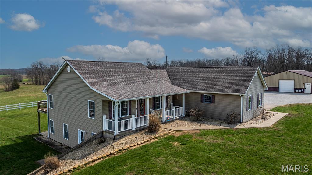 Additional 20 acres are available for purchase. Located in the rolling hills of Perry County, this stunning farm offers the perfect opportunity to live out your dream country side lifestyle or expand the one you already love.
At the heart of the property sits a beautiful ranch-style home featuring nearly 3,100 square feet of living space, including 5 bedrooms and 3 full bathrooms. The main level features an inviting entry foyer that opens into a spacious living area with vaulted ceilings. Additional highlights include a separate dining room and a kitchen with a breakfast nook and bar seating. The primary suite offers a recently updated en-suite bathroom complete with a freestanding soaking tub. Two additional bedrooms and a full bathroom complete the main floor. A full walk-out basement provides the other 2 bedrooms and full bath, additional living and entertaining space, complete with a bar area. And outside? Enjoy the serene views on either the covered front porch or the covered back deck that expands your living space. As an added bonus the 2 car oversized garage is equipped with heated floors. 
The acreage is thoughtfully set up with perimeter fencing perfect for running cattle, roaming horses, recreation, or even creating your own private lake. Standout features include a 1800 sq ft insulated shop with a half bath, bar area, and horse stall. Additionally another 1800 sq ft outbuilding (built in 2020) suitable for equipment storage or workshop use. Both structures feature covered lean-to additions for more storage.
Conveniently located approximately 10 minutes from Perryville and 30 minutes from Cape Girardeau, this property offers a rural setting with convenient access to nearby amenities. Space, privacy, and opportunity all wrapped into one incredible property.