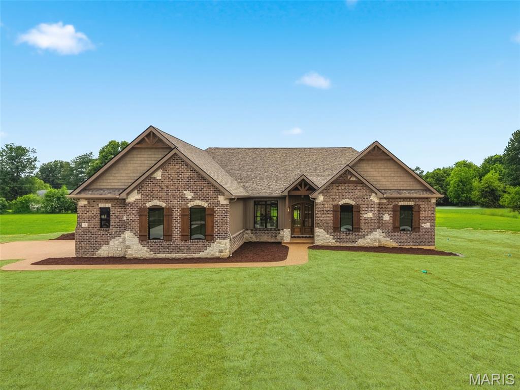 ABSOLUTELY SUNNING HOME!!! This beautiful stone and brick residence sits on over 3 acres in the highly sought-after Josephville area within the Fort Zumwalt School District. The spacious, level backyard is perfect for adding a pool. This custom home is packed with details and high-end finishes. The first floor boasts soaring 10-foot ceilings and tray ceilings with wood accents in the entry hall, kitchen, and master bedroom. Enter through 8-foot arched wood doors to find a formal dining room to the left with large arched openings. Your gaze will be drawn to the abundance of windows across the open-concept kitchen, breakfast area, and great room, along with fully opening 8'x8' doors. The kitchen is a showstopper, with cabinets stacked to the ceiling, lighted glass display cabinets, and professional-grade appliances including a 48-inch, 8-burner dual fuel range topped with a matching 48-inch range hood. A floor-to-ceiling stone fireplace is flanked by built-in cabinetry and shelving. The screened-in porch is ideal for relaxing or entertaining. Down the wide hallway are two large bedrooms, each with walk-in closets, sharing a bathroom at the end. The master suite at the back features a 22' x 15' space, two walk-in closets, and a luxurious en-suite with a soaking tub and huge walk-in shower. The lower level houses the fourth bedroom with a Jack-and-Jill bathroom that can be made private, plus two spacious sitting areas and rough-in for a private bar. With nearly 1,500 square feet finished downstairs, there’s still plenty of unfinished space for storage or future expansion, including an area under the front porch that could be converted into a safe room. The first level is finished in wood flooring except the laundry room hall bath and primary bath which are ceramic tile. The lower level is all LVP flooring
This is a must see!!! A lot of house for the money!!!!
PROFESSIONAL PICTURES COMING NEXT WEEK - Expected to be ready by 5/27/2026!!!!
