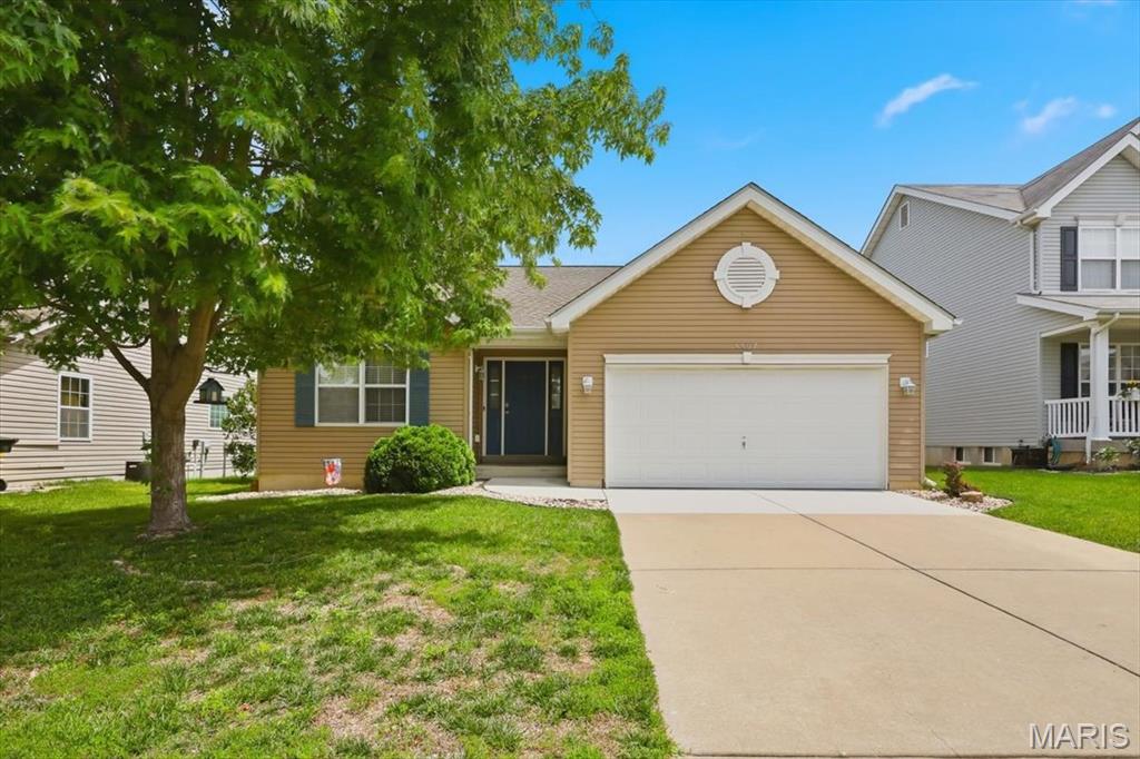 Welcome home to comfort, convenience, and peace of mind! Tucked into a quiet cul-de-sac in Cottleville, this charming ranch home is a perfect match whether you are buying your very first home, downsizing, or looking for easy main-level living. The open-concept floor plan greets you with soaring cathedral ceilings and abundant natural light. Designed with a desirable divided bedroom layout, the primary suite features a spacious walk-in closet and private ensuite bath. You'll love the ultimate convenience of main-floor laundry and adult-height fixtures in both bathrooms. Outside, enjoy a level, fully fenced backyard with a patio—ideal for pets, play, or relaxing. Major updates mean less stress: the roof is less than 5 years old and the concrete driveway is brand new! Need more space? The deep, 8-foot pour basement includes an egress window, ready for a future third bedroom, rec room, or massive storage area. Located just minutes from premier Francis Howell schools, popular dining, shopping, and easy highway access. Refrigerator and Ring doorbell stay! Don't miss this move-in ready opportunity!