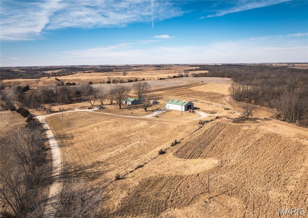 Escape to the peace and privacy of northern Missouri with this recently updated 1,650-square-foot single-level home situated on 3.1 acres in Sullivan County. Surrounded by expansive farmland, this 3-bedroom, 2-bath property offers the perfect blend of country living, recreation, and investment potential.
Whether you're looking for a full-time residence, hunting retreat, or income-producing property, this versatile property checks all the boxes. Previously operated as both a hunting lodge and a successful short-term rental, it is well-suited for hosting family, friends, or outdoor enthusiasts.
The standout 480-square-foot man cave provides endless possibilities as a trophy room, entertainment area, game room, or bunk space for hunting buddies. Outside, a 60' x 40' shop offers exceptional storage and workspace for ATVs, tractors, implements, boats, trailers, and all your hunting and outdoor gear.
Enjoy the tranquility of rural living with plenty of room to spread out, entertain, and pursue your outdoor passions. Properties with this combination of comfortable living space, extensive outbuildings, and proven recreational appeal are hard to find.