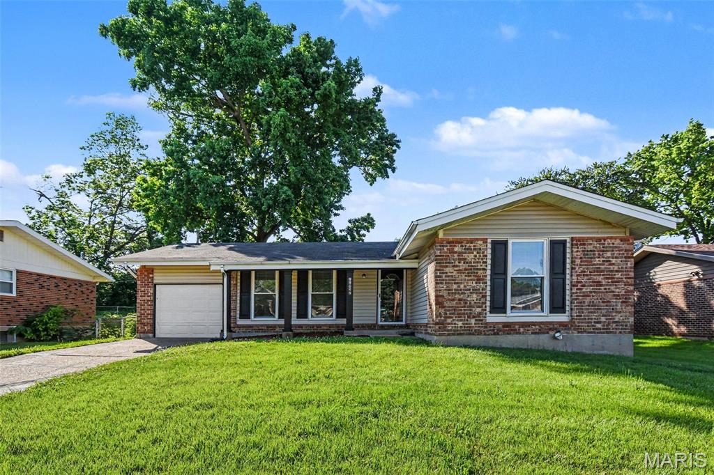 This move-in-ready three-bedroom, two-bathroom, home features a classic, traditional floor plan that offers dedicated, well-defined spaces for everyday living. The property boasts two living spaces, a functional kitchen with ample storage space and generously sized bedrooms. Below the main level, an unfinished basement provides a blank canvas with ample room for storage or future expansion, and the exterior boasts a private, fully fenced-in backyard that offers a secure space for outdoor enjoyment. Schedule your showings today!
