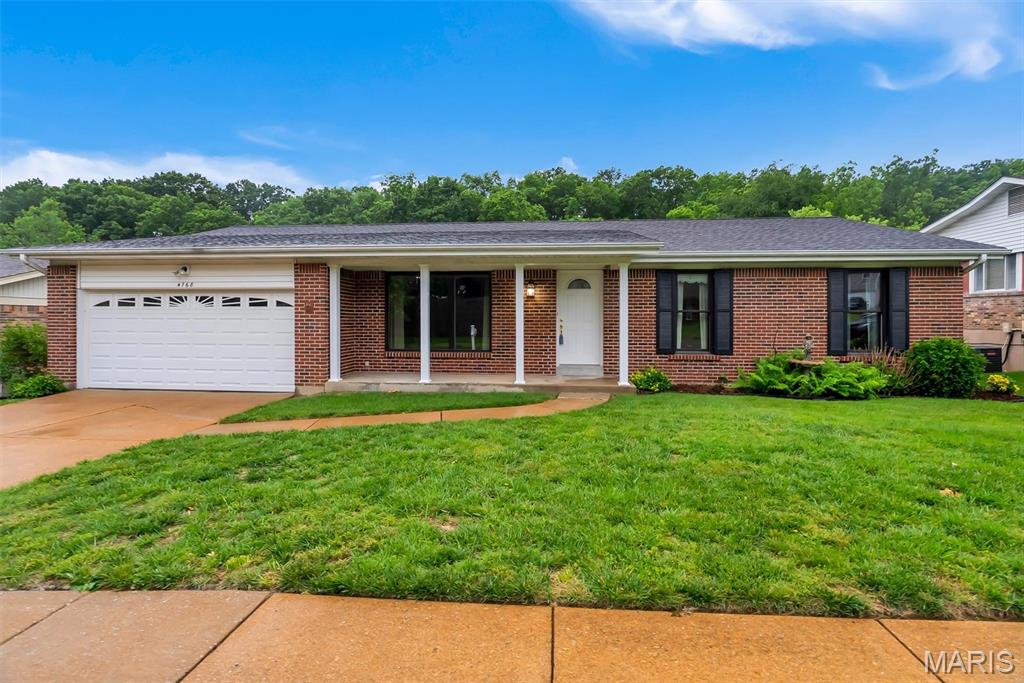 Welcome to 4768 Longspur Drive in desirable Cardinal Springs in the Lindbergh School District!   This lovely home was built in 1978 and maintains it's mid-century charm with a few modern updates.    There are three roomy bedrooms and 2.5 baths with a primary bedroom with walk-in shower.  The main living areas of the home are carpeted and they have all been professionally cleaned so you can move right in!  The home boasts 1,746 square feet of living space on the main level and approximately 900 square feet in the  finished walk-out basement.  There's a storage room in the basement with shelving units and plenty of space in the laundry room for more if needed.

The living room and dining room area have a combined open floor plan...with the kitchen just off the dining area.   There are sliding glass doors in the kitchen that lead to the beautiful screened-in patio with a stairway to the backyard and basement entrance.  The family room has a gas fireplace for those cozy winter nights.   The basement has been partially finished and a half bath added.   Great lighting and sliding glass doors to the backyard and the creek!   The home backs up to a common area that runs along Mattese Creek.  Great views from the screened-in back patio!  A two car garage with entrance into the kitchen makes this house accessible from just about every level and every direction!   

A sump pump and drain tile were installed around 2018 along with quality Anderson windows.  The furnace and central air were replaced in 2025 and I believe the hot water tank was replaced as well.     We are unsure of the age of the roof but it has been replaced at some point.  It's a beautiful home in a friendly, quiet neighborhood.  We think you'll want to make it your neighborhood too!   (Note 5/18 - Many more updated photos coming today or tomorrow.)