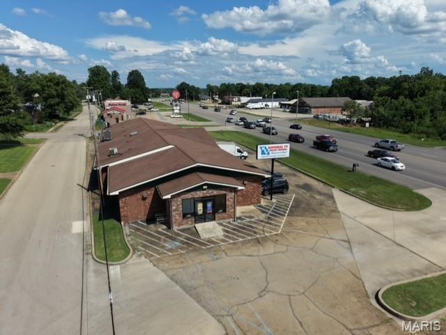 Prime 6500 SF Commercial opportunity in a high-traffic location with outstanding visibility. OVER 16,000 vehicles pass this facility every day. This spacious building offers endless possibilities for retail, office, medical, restaurant, or service-based businesses. Ample on-site parking provides convenient access for customers and employees, while the excellent location ensures maximum exposure. A rare investment or owner-user opportunity in a thriving commercial corridor. Building is currently leased out with positive ROI. Additional lot (parking lot to the north) is ready to build on too! Plans, approval and easements are in place.