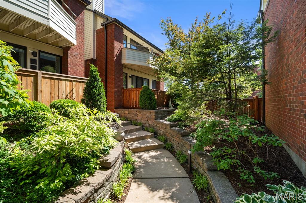 Welcome to the heart of the Central West End! This beautifully updated 2 bed, 2 bath condo in the desirable Waterford Square community blends modern updates with timeless charm and low-maintenance living. This bright corner unit features refinished hardwood floors, abundant natural light, and an open living and dining area complete with a cozy fireplace and expansive windows overlooking peaceful green space and the private patio area.
The beautifully refreshed kitchen shines with new cabinets, countertops, backsplash, sink, faucet, and newer stainless steel appliances including the refrigerator, dishwasher, microwave, and oven. The spacious primary suite offers generous storage and comfortable living, while the upgraded guest bathroom adds even more style and functionality. In-unit laundry includes washer and dryer, and the attached 2-car tandem garage provides rare convenience plus extra storage space. Secure building access adds peace of mind.
Major updates include refinished hardwood floors (2024), upgraded guest bath (2024), new kitchen cabinets (2024), new kitchen appliances (2024/2025), new countertops, backsplash, sink, and faucet (2025), outdoor rocks and landscaping (2025), replacement windows (2026), and washer/dryer (2023).
Located just minutes from Forest Park, Washington University, BJC Medical Campus, MetroLink, dining, shopping, and entertainment, this move-in ready condo offers the perfect combination of comfort, style, and unbeatable location!