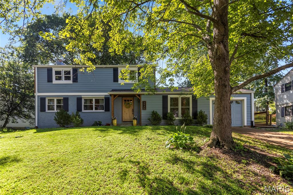 Open Sat, 7/18, 12-2pm. Tucked on a quiet lane in the heart of Kirkwood's Dougherty Ferry corridor, 2240 Ferncliff Lane delivers the rare combination of a fully renovated home and a neighborhood that feels genuinely settled and connected. This one was renovated top to bottom for how people actually live, and the difference shows the moment you walk in.

The main floor moves the way a busy household needs it to. The living room is anchored by a newer gas fireplace with a slate tile surround, flanked by custom built-ins and a handcrafted mantle that give the room real character. From there the space flows into a kitchen finished with quartz countertops, quartz backsplash, and new GE appliances, with a custom open staircase adding an architectural moment you don't expect at this price point.

The vaulted family room is the everyday hub, a true second living space filled with natural light from Pella windows, and it walks out to a new wrap-around deck that extends the living area outside from spring through fall. Main floor laundry and a proper mud room handle the daily chaos of backpacks, cleats, and muddy paws.

Upstairs, the vaulted primary suite feels like a genuine retreat, with a walk-in closet and a fully tiled walk-in shower with double shower heads. All new lighting and fresh paint inside and out keep the whole house feeling crisp and move-in ready.

Just as important is what you won't have to think about. Newer HVAC, Pella windows throughout, newer Hardie siding and trim, newer gutters, newer garage door and opener, and a newer roof. The expensive, unglamorous work is already done.

Then there's Kirkwood itself. You're minutes from the farmers market, the shops and restaurants of downtown, and Kirkwood Park with its pool, ice rink, and summer concerts!