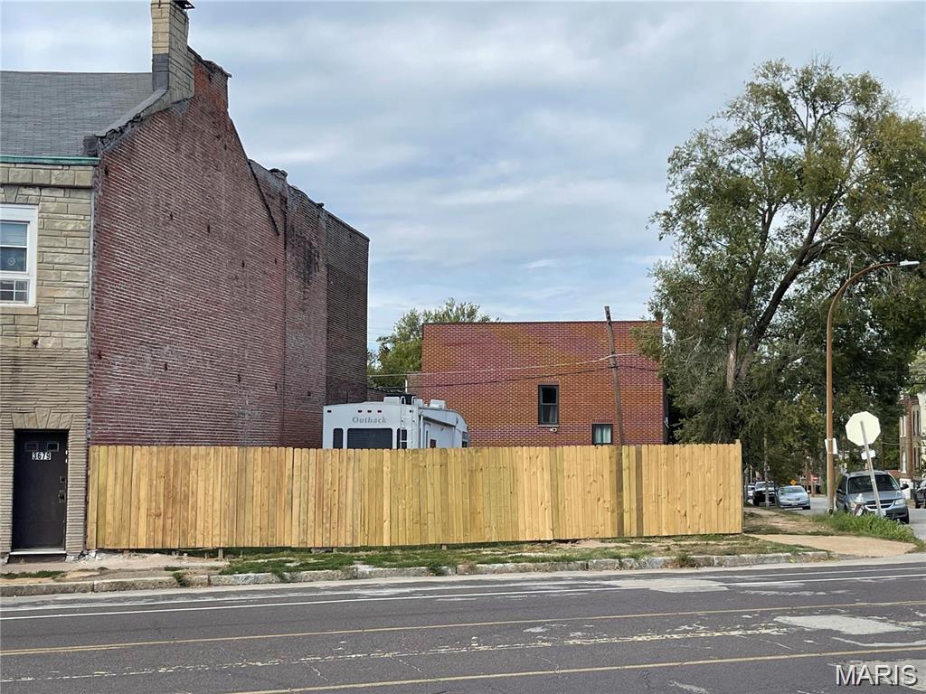 Storage lot, used car lot, farm stand. This appox. 1500 sq ft unimproved fenced commercial lot sits on Broadway just a few blocks north of the intersection of Broadway, Jefferson & Chippewa and a few blocks south of the AB brewery 1900 cars a day drive by this location making it a good location for many commercial uses. Zoned Industrial-J. RV shown in pictures can be included as part of the sale if desired.