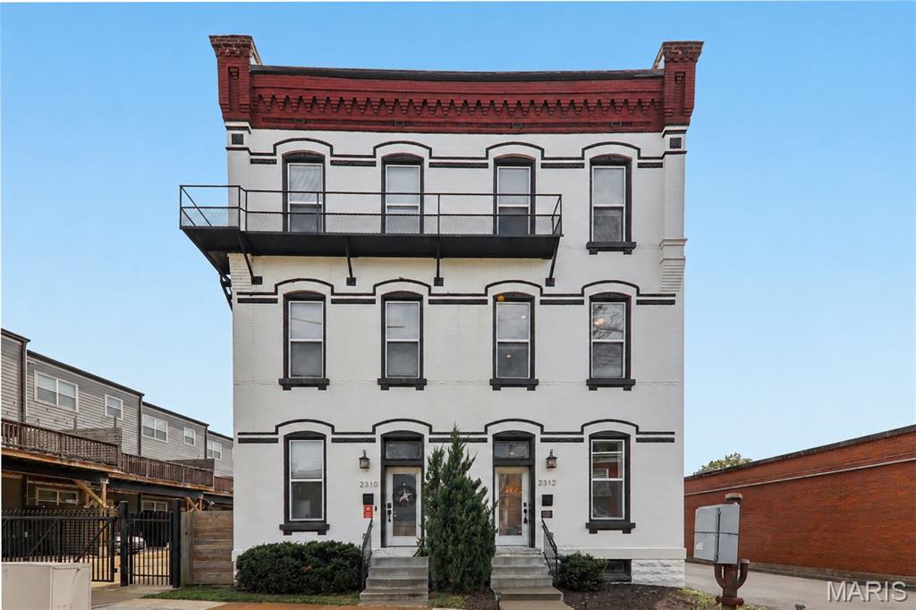 Exceptional design. Historic character. Unmatched Benton Park living.

Set among the storied architecture and vibrant streetscapes that have made Benton Park one of St. Louis' favorite historic neighborhoods, this extraordinary fee-simple townhome delivers a rare blend of timeless character and sophisticated modern luxury.

Completely reimagined from the century-old brick walls inward, every detail has been thoughtfully curated to create a residence that is both visually stunning and exceptionally livable. Offering more than 2,400 square feet, the home showcases soaring ceilings, rich oak flooring, exposed brick accents, and an open-concept floor plan designed for effortless entertaining and everyday living.

The designer kitchen is a true centerpiece, featuring elevated finishes, custom details, and distinctive touches that set it apart from anything else on the market. Upstairs, the expansive primary suite offers a private retreat unlike any other, highlighted by a jaw-dropping spa-inspired bath worthy of a luxury boutique hotel. Two additional bedrooms, three additional full baths, and dual laundry hookups provide exceptional flexibility and convenience.

Outdoor living is equally impressive with a main-level deck, two private balconies, a fenced backyard, and an oversized two-car garage—an uncommon amenity in one of the city's most architecturally significant neighborhoods.

And then there's the location. Nestled in the heart of historic Benton Park, you'll enjoy walkable access to neighborhood favorites, local restaurants, coffee shops, parks, community events, and the distinctive charm that has made this area one of St. Louis' most sought-after destinations. With convenient access to downtown, major highways, and everything the city has to offer, this is urban living at its finest.

Stylish. Sophisticated. Distinctive.

Simply put, this home is exceptional.  

(Relocation Listing - Agents see notes/supplements)