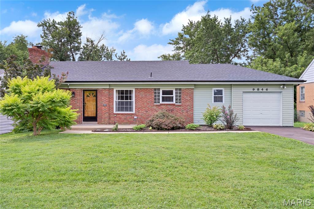 Welcome home to this move-in-ready 3-bedroom, 2-bath home with a 1-car garage, ideally located in a desirable neighborhood near schools, parks, shopping, and popular dining establishments. Offering the perfect blend of comfort, style, and convenience, this inviting home features a bright, spacious floor plan with beautiful hardwood flooring throughout the main level. The eat-in kitchen provides ample cabinet space, stainless steel appliances, a gas range, and the refrigerator stays with the home. Charming architectural details, including arched doorways and glass block windows, add character, while the updated electrical panel and security system provide added peace of mind. The finished lower level expands your living space with a cozy stone-surround wood-burning fireplace, a full bath, and a laundry area complete with washer and dryer that will remain with the home. Major updates include a new roof/gutters (2024), repaved driveway (2026), and new sump pump (2026). Generously sized bedrooms and comfortable living areas make everyday living easy, while the gas fireplace with a marble mantel creates a warm focal point. Step outside to the large, fully fenced backyard—perfect for entertaining, relaxing, gardening, or enjoying outdoor activities with family and friends.