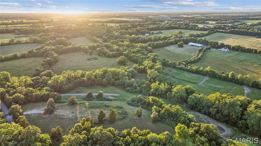 A rare chance to own approximately 22 private acres in the heart of Warren County. This is the kind of wide-open canvas that almost never comes available.
Tucked into a quiet, natural setting, this property is all about space and possibility. A small creek meanders through it, adding charm and a picture-perfect backdrop for the custom home you've always envisioned. Build your dream homesite, establish a hobby farm, or claim it as your own recreational retreat. With 22 acres, there's room to do it all and still have land to roam.
Privacy here is the real luxury. Enjoy abundant wildlife, peaceful views, and seclusion that's increasingly hard to find, reached by private road access off Lix Road that keeps the outside world at arm's length. Yet you're never cut off. I-70 is just four minutes away, with Warrenton's shops, schools, and amenities only minutes beyond. A portion of floodplain acreage enhances the natural landscape and draws the wildlife that makes this place feel alive.
Want a different footprint? This tract is also available as separate parcels of approximately 15 acres (MLS #26038862) and 5-7 acres (MLS #26038876). Explore all the options and find the one that fits your vision.
Come walk it. Start imagining what's possible.