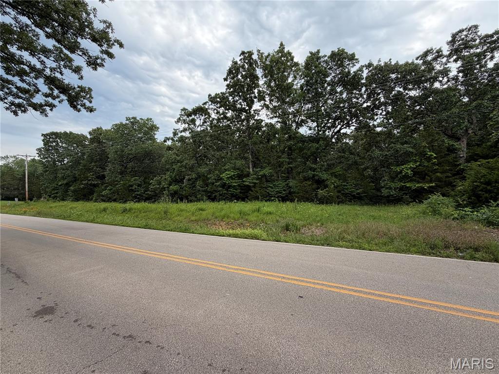 Discover the potential of this beautiful 7 acre wooded property located on Highway OO. Offering a private, natural setting with mature trees and abundant wildlife, this acreage provides the perfect opportunity for a future homesite, recreational retreat, or investment property. Enjoy the peace and privacy of country living while maintaining convenient access to nearby amenities. Property is being sold as-is. Don't miss your chance to own this scenic piece of land.