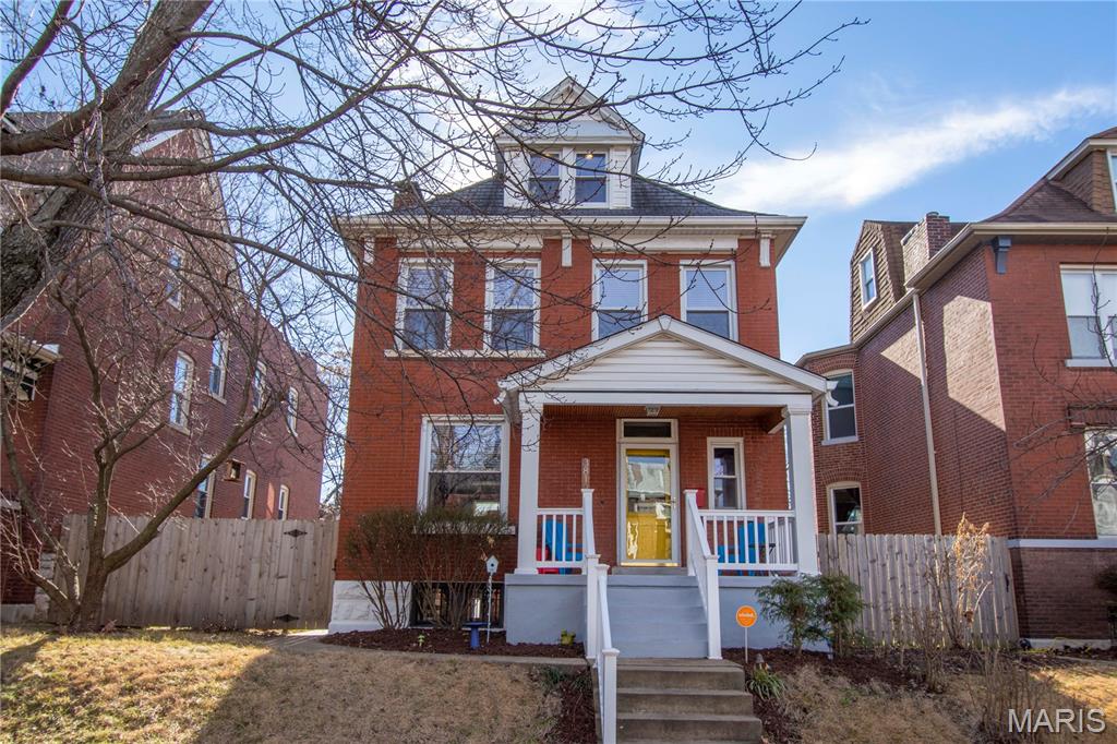 Discover timeless charm and modern comfort at a beautifully maintained 1906 residence offering over three levels of living space. This spacious home features 4 bedrooms and 2.5 bathrooms, blending historic character with thoughtful updates throughout.

The renovated kitchen is designed for both everyday living and entertaining, featuring stainless steel appliances, a gas range, center island, stone countertops, and abundant prep space. The open floor plan flows seamlessly from the kitchen into the dining room, while the inviting living room with fireplace provides the perfect gathering space.

Enjoy the changing seasons from the expansive screened-in porch overlooking the fully fenced backyard. Additional outdoor amenities include a one-car garage and plenty of yard space for recreation and gardening.

The second floor offers three bedrooms and two full bathrooms, including a spacious primary suite with a private bath and custom walk-in closet. The versatile third floor serves as an ideal fourth bedroom, recreation room, home office, or guest retreat.

A clean, dry basement provides excellent storage and workshop potential.