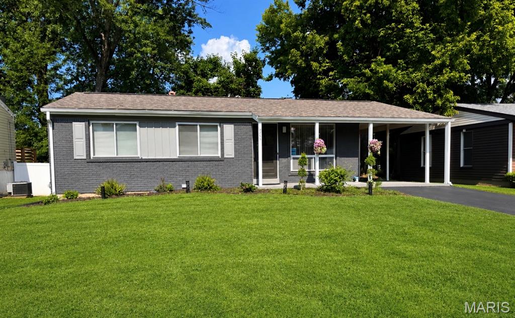 The cherry on top!  This beautiful home has been updated with premium toppings - New appliances , new flooring, new lighting, landscaping,  wonderful bathrooms, finished lower level great room. Its got lots to be excited about. Three main floor bedrooms!  Amazing fenced yard and deck.  Attached carport.  Covered front porch is delightful.  Its going to be so sweet living in this well designed and loved home.  This home is in the final stages of renovation we look forward to showing it off and will update the photos as soon as we can, put it on your calendar to see and grab it while you can.