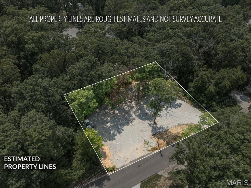 Here's your chance to grab not one but TWO lots at the lake! Both lots have been freshly cleared with new gravel throughout, making the space flat, spacious, and ready to use. (Plat 21, Lots 58 & 59). 
This double lot has been recently refinished with a second tier for all of your camping needs and summer festivities! 
This one is ready to go for your weekend getaways and peaceful escapes, complete with electric service, a Johnny on the Spot and a portable water storage tank. 
Tucked just off a paved road, this spot gives you that off-the-beaten-path privacy while keeping you close to everything — the back beach and boat ramp are just around the corner, and restrooms and campgrounds are a short ride away.
Spend your day out on the water, then come back to your own quiet, tucked-away retreat to camp and relax. The perfect setup for weekend getaways or all-summer stays! 
The gated community of Goose Creek spans approximately 400 acres and is ideal for a wide variety of water sports, from boating and swimming to fishing and relaxing by the water. 
Offering a host of amenities including a swimming pool, recreational hall, two playgrounds, and several smaller lakes perfect for fishing or non-motorized boating. 
Make the most of your family's summer with community poker runs, turtle and mouse races, fishing tournaments, holiday parties, kids’ movie nights, and more!