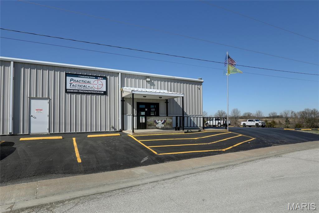 Exceptional opportunity to acquire a purpose built indoor shooting range facility offering immediate income potential in the established LaGrange, MO Industrial Park. This ±9,000 square foot building sits on 1.4 acres of frontage with ample on-site parking (25 spaces) and is designed for both performance and durability.

This state-of-the-art indoor range facility with advanced tactical targeting systems features five 50-yard rifle lanes and eight 30-yard pistol lanes, all equipped with programmable shooting capabilities for dynamic training and customizable user experiences. Constructed with 9-inch concrete walls, the range is fully outfitted with ballistic rubber lining and a rubber bullet trap system, and is rated up to .338 Lapua, accommodating a wide range of firearms use. 

Approximately 1,000 square feet is dedicated to retail, classroom, and office space, creating additional revenue opportunities through training, merchandise, and memberships.

Additional highlights include:
 • Metal exterior construction for long term durability
 • Three-phase, 800-amp electrical service
 • City water and sewer
 • High end professional grade ventilation system designed for indoor range use
 • Tactical programmable Range Systems™ targeting throughout

This property is ideally suited for investors or owner-operators seeking a high-demand recreational and training facility with immediate income potential.