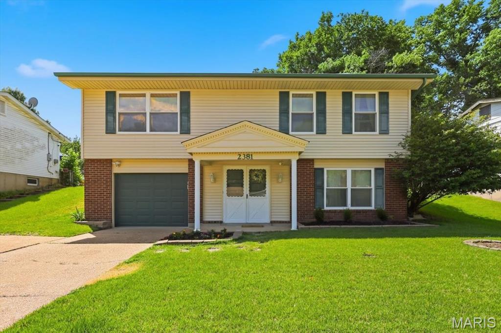 Look no further...... here is that updated home you have been looking for.  Check out the updated kitchen cabinets, plus the two-year-old refrigerator stays.  The main floor bathroom has also been mostly updated.  There is more: white six-panel doors, a low-maintenance deck,  vinyl siding, and a double-wide driveway for your convenience.   New roof to be put on in July 2026.  The washer and dryer stay, so now all you have to do is move in and continue with your busy lives.  Located not far from the awesome Maryland Heights Recreation Center with a pool, and just a short drive to the 2,000-acre Creve Coeur Park & Lake.