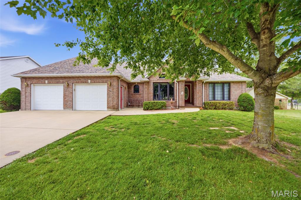 This all brick 3 bedroom 2 bath home in Harlan Estates offers comfort, space, and timeless style in one of the areas most desirable neighborhoods. Featuring hardwood flooring throughout, an open split-bedroom floor plan with large bedrooms and soaring vaulted ceilings, this home is designed for both everyday living and entertaining. The spacious kitchen with granite counter tops, custom cabinetry, pantry with slide out shelves and a spacious dining area.The oversized primary suite includes a huge primary bath complete with a relaxing jacuzzi tub, two walk-in closets. Main floor laundry with utility sink with storage space.Newer roof. Enjoy peaceful mornings on the screened-in porch. Additional highlights include a full  unfinished basement with abundant storage space mature landscaping, and plenty of room to grow. Neighborhood includes the use of Tennis Courts, Basketball Courts and Stocked lake.