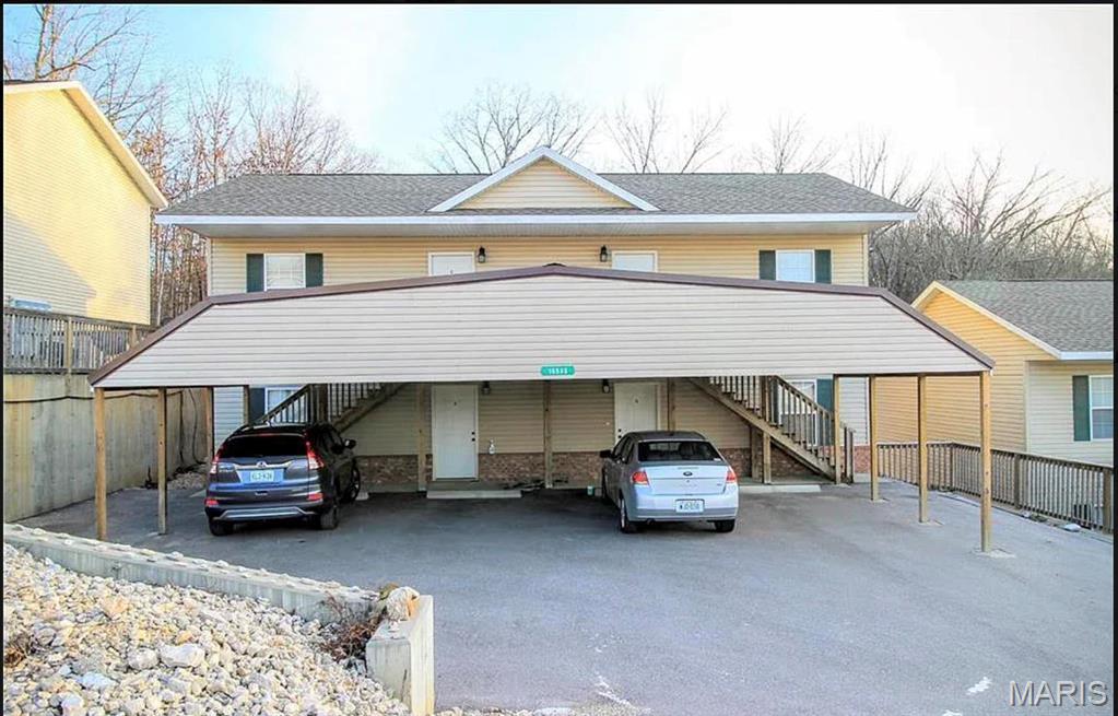 Check out this 4-plex building that is fully rented and ready for a new investor! This building has four, 1 bedroom, 1 bathroom units and is located in the Hunters Ridge Subdivison within the Waynesville School District and close to FLW. All units feature an open concept kitchen/living room with tile flooring and carpet. The bedroom boasts carpet and a large closet. The bathroom is large & has a shower/tub combo and a closet laundry area with stackable washer/dryer. All units are managed by a professional property management company and have been well maintained and consistently rented. Simply continue with the current management company, move in & let property management handle the rest. Rent is currently at $850/unit. Owner is responsible for water & sewer, tenant pays all other utilities. Property is sure to be a great fit to your investment portfolio.