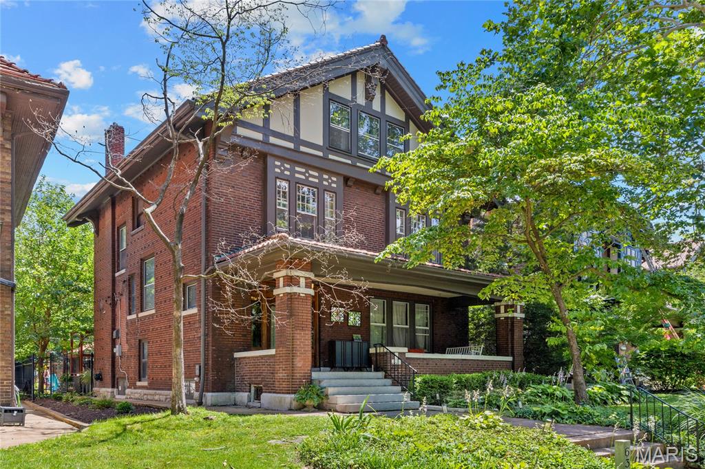 Handsome historic residence in the highly sought-after Parkview neighborhood, affectionately known as an urban oasis. Showcasing timeless architecture and exceptional curb appeal, this home beautifully blends original character with updated kitchens and baths. Step inside to discover tall ceilings, exquisite quarter-sawn oak millwork, and hardwood floors throughout most of the house. Graciously proportioned living spaces include a welcoming living room with a fireplace, a spacious dining room ideal for entertaining, and a renovated kitchen featuring stainless steel appliances, stone countertops, and a butler’s pantry area. A convenient rear door opens to the backyard and charming deck, creating an effortless indoor-outdoor connection. Completing the first floor is the renovated half bath. The second floor is accessed by a turned staircase with a beautiful stained-glass window at the landing. Here you'll find generously sized bedrooms, including a primary suite with renovated on-suite bath, two additional bedrooms, and a new large hall bath with second-floor laundry. The third floor offers even more flexibility with two additional bedrooms and a full bath—perfect for guests, home offices, or recreation space. Outside, enjoy a fenced rear yard with a picturesque vine-covered deck and a detached two-car garage. The home is ideally situated directly across from one of Parkview’s two neighborhood parks, providing a wonderful setting for soccer, play, and outdoor enjoyment. Recent owner improvements include renovated baths, newer second and third-floor air conditioning systems and updated appliances. The second-floor washer and dryer will remain with the home. This premium Parkview location is renowned for its vibrant community and active social atmosphere, while also offering easy walking access to Forest Park, Washington University, popular restaurants, shops, and neighborhood amenities.