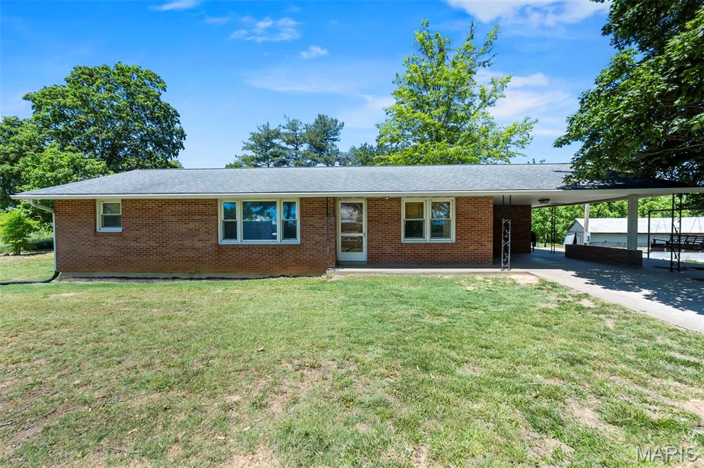 Tucked away on 5+ beautiful acres, this charming all-brick ranch offers the perfect blend of country living and modern updates! Featuring 4 bedrooms and 1 beautifully remodeled bathroom with dual vanity sinks, this home has been thoughtfully updated throughout. The completely remodeled kitchen is the heart of the home, while the convenience of main-level laundry adds everyday ease. The mostly finished basement expands your living space with a kitchenette, spacious family/recreation area, and a 4th bedroom complete with an added egress window. There’s also potential to finish out an additional bathroom in the lower level. Outside, you’ll find two outbuildings, including one that served as a makeshift chicken coop. Perfect for hobby farming or extra storage. Enjoy peaceful country views, room to roam, and endless possibilities on this versatile property!