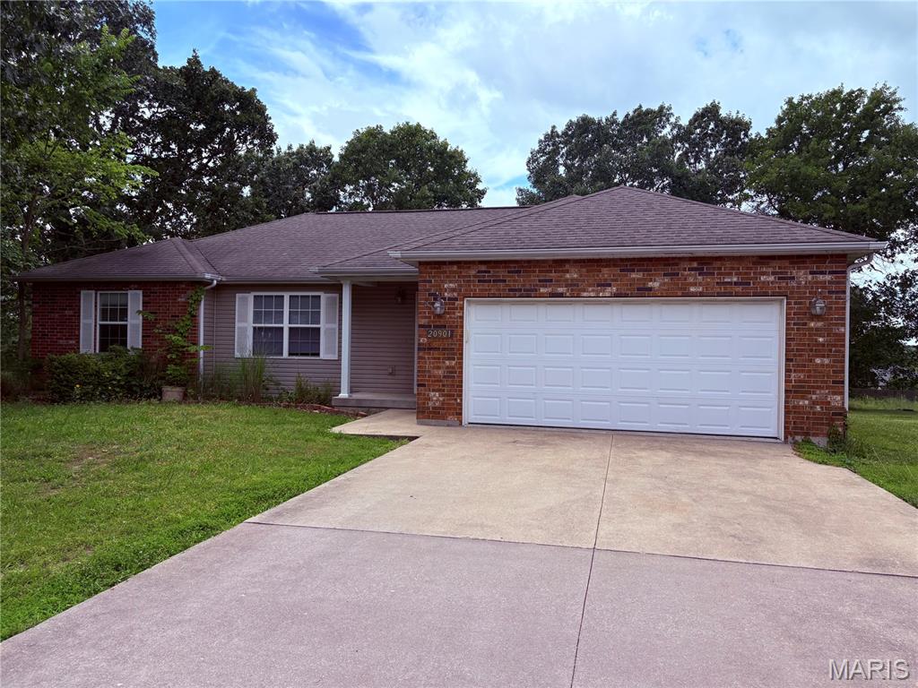 Great home in great subdivision! Located in the popular Shalom Mountain development this 3 bedroom 2 full bath with 2 car garage is priced very well.  The living space is of this home generous and feels big. The dining space is just off the well appointed kitchen with an open concept. The kitchen has great counter space with refrigerator, dishwasher, microwave, and electric oven/stove. You'll enjoy the divided bedroom floor plan allowing the master suite its own private bath and end of the home.  The two other bedrooms are nice size with a full bathroom between them. Enjoy the level lot this home is located on with a nice back yard area plus a deck. This home is well cared for on paved streets, and close to downtown Waynesville.  Don't wait! This home is priced to sell!