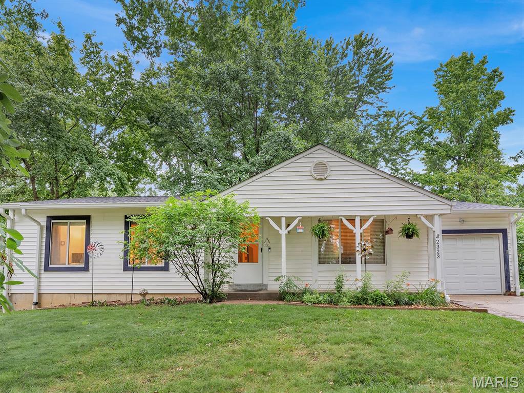Welcome home to 2323 Sundance Drive in the established Amarillo Village subdivision of O'Fallon! This well-maintained 4-bedroom, 1.5-bath home offers 1,144 square feet of comfortable living space, thoughtful functionality, and plenty of room both inside and out. Step inside to find an inviting eat-in kitchen with ample space for entertaining and everyday gatherings. The home's practical floor plan features four bedrooms, providing flexibility for family, guests, or a home office. The full basement offers exceptional storage and workspace with built-in workbenches, making it ideal for hobbyists, DIY enthusiasts, or anyone needing extra room for projects and organization. A one-car attached garage adds convenience and additional storage options. Outside, you'll appreciate the mature trees, established landscaping, and well-cared-for yard that create a peaceful setting. The backyard is truly a private oasis, featuring a covered patio perfect for relaxing, entertaining, grilling, or enjoying your morning coffee while taking in the serene surroundings. Located within the highly regarded Fort Zumwalt School District and just minutes from shopping, dining, parks, recreation, and major commuter routes, this home offers the perfect combination of comfort, convenience, and value. Enjoy easy access to all the amenities and attractions that make O'Fallon one of St. Charles County's most desirable communities. Available for showings starting Saturday 6/13, Open House Sunday 6/14 from 12pm-2pm