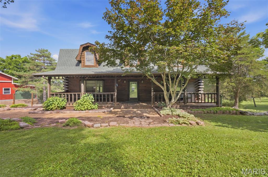Location, Location, Location,  Escape to the perfect blend of rustic charm and modern convenience with this beautiful 4 bed, 2.5 bath log cabin with a 1,500 square foot barn.  Surrounded by nature yet just minutes from shopping, dining, schools, and major highways. This property offers the best of both worlds.