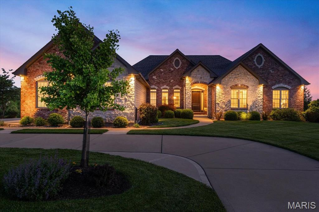 Discover the pinnacle of single-story living in this stunning custom ranch, masterfully designed and constructed by Whalen Custom Homes in the gated community of Pevely Farms. Nestled on a premier 1.07-acre lot, every inch of this residence reflects a commitment to quality and a passion for architectural detail. From the moment you arrive, the home’s striking curb appeal sets the tone, with beautifully curated landscaping, a full irrigation system, and a timeless blend of brick and stone creating an elegant first impression. The heart of this home is its magnificent high-ceiling open-concept great room, where natural light pours in, highlighting the seamless transition to the gourmet kitchen designed for culinary enthusiasts. Featuring quartz countertops, a massive center island, stainless steel appliances, and a spacious walk-in pantry, this space is as functional as it is beautiful. The adjoining hearth room offers a cozy sanctuary for crisp evenings by the fire. Step outside to your expansive covered deck, thoughtfully designed for year-round enjoyment with built-in gas hook-ups, perfect for grilling or outdoor heating. A ceiling fan keeps the summer air moving as you take in panoramic, unobstructed views of the surrounding wooded hills, Pevely Farms Golf Club, and the Meramec River bluffs. The backyard is equally impressive, complete with an aluminum fence for a clean, polished aesthetic without compromising the view! Designed for ultimate convenience, the home features four bedrooms and 2.5 bathrooms on the main level, ensuring everyone has their own space. You’re sure to love the main-floor laundry complete with a custom dog shower, along with wider hallways and oversized 36" doors that enhance everyday livability. Car enthusiasts and hobbyists alike will appreciate the oversized 3-car garage, complete with a custom-coated floor, upgraded overhead lighting, and higher-clearance garage doors. The journey continues in the finished walk-out lower level, featuring an open-concept recreation area, 8'8" ceilings, and an additional convenient half bath. The lower level opens directly to the lush backyard and patio, creating the perfect setting for entertaining. With a new roof (Oct 2024) and located in the prestigious Rockwood School District, this home is ready for its next chapter. Schedule your showing today!