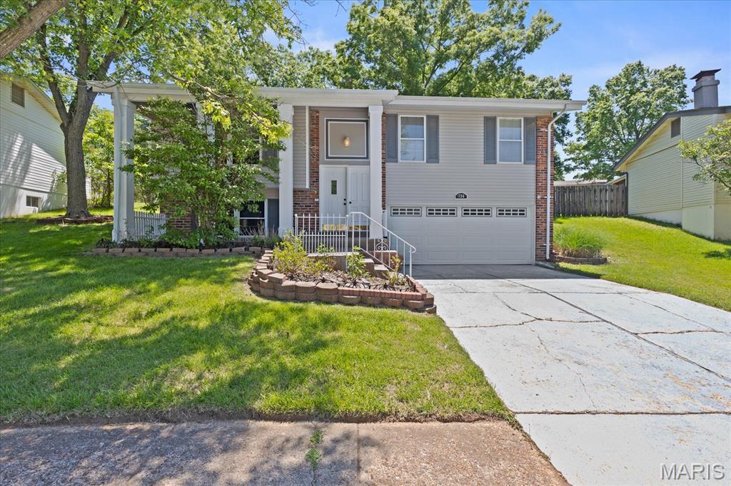 This well-maintained split foyer home features 3 main-level bedrooms and 2 updated bathrooms.  New carpet throughout including the ,spacious primary suite.  The second and third bedrooms are great for a home office or guests.  The eat-in kitchen has freshly painted kitchen cabinets, new stainless steel appliances and updated laminate flooring.  The lower level adds extra family space for recreational space to use for entertainment or growing room needed for your lifestyle with a woodburning fireplace. An oversized 2-car garage provides plenty of room for parking, storage, or a workshop area. The fenced in backyard is ready for those quiet evenings outside.  Recent updates include fresh interior paint, new carpet and a brand-new front door.  Conveniently located close to shopping, dining, and everyday amenities, this home offers comfort, space, and convenience.