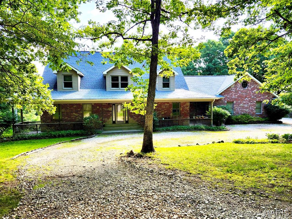 Beautifully maintained and updated 4 bedroom 4.5 bath home on 47+/- acres near Bourbon, MO.  An amazing country setting filled with woods and wildlife.  This custom homes features an inviting covered front porch, 2x6 construction, and lots of woodwork.  The main floor starts with 2-story entryway, oak flooring, a main floor master suite, large living room, kitchen with custom cabinets, breakfast and a dining room. Upstairs are two more spacious bedrooms and a full bathroom.  The finished walk out lower level includes a 9 ft pour, an extra bedroom, craft room, wet bar, full bathroom and lots of storage. The attached 3 car garage is oversized, has A/C, a 1/2 bathroom and attic access. An additional newer outbuilding with electric provides plenty of space for all your toys or hobbies.  Schedule your private tour today and come see everything this property has to offer. Just 5 miles from Bourbon and I-44 and only an hour from St. Louis.