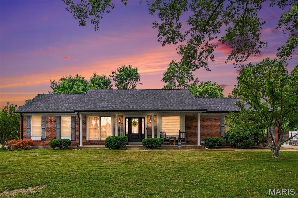 Welcome to this stunning, fully renovated 3-bedroom, 2.5-bath home offering over 2,000 square feet of beautifully updated living space. No detail has been overlooked in this top-to-bottom remodel, featuring a desirable open floor plan, real wide-plank hardwood flooring, and high-end finishes throughout.

The designer kitchen is truly a showstopper, boasting premium smart appliances including a top-of-the-line GE Monogram oversized range, Bosch smart refrigerator, Sharp microwave drawer, and matching smart dishwasher. Control appliances remotely, preheat your oven from your phone, and enjoy the convenience of modern smart-home technology integrated throughout the property.

The spacious living area centers around a professionally cleaned and inspected wood-burning fireplace, while elegant lighting from Metro Lighting and custom fixtures throughout the home add sophistication and style. The primary suite features a stunning chandelier with retractable ceiling fan blades, creating the perfect blend of luxury and functionality.

Both upper-level bathrooms feature Bluetooth-enabled ventilation fans with built-in speakers and lighting. Major updates include a new architectural-shingle roof, oversized gutters, new furnace, new electrical wiring, new light fixtures, hardware, faucets, door knobs, hinges, registers, and more—virtually everything has been replaced.

Enjoy outdoor living on the screened-in porch overlooking the property. The lower level includes a convenient half bath and additional framed space ready for future finishing, with materials and supplies included for the new owner's use.

Additional highlights include a 2-car garage, Brinks security system, smart lighting, smart home features, and exceptional attention to detail throughout. This move-in-ready home offers the rare opportunity to enjoy modern luxury, premium upgrades, and peace of mind knowing the major systems have already been updated. Schedule your private showing today!