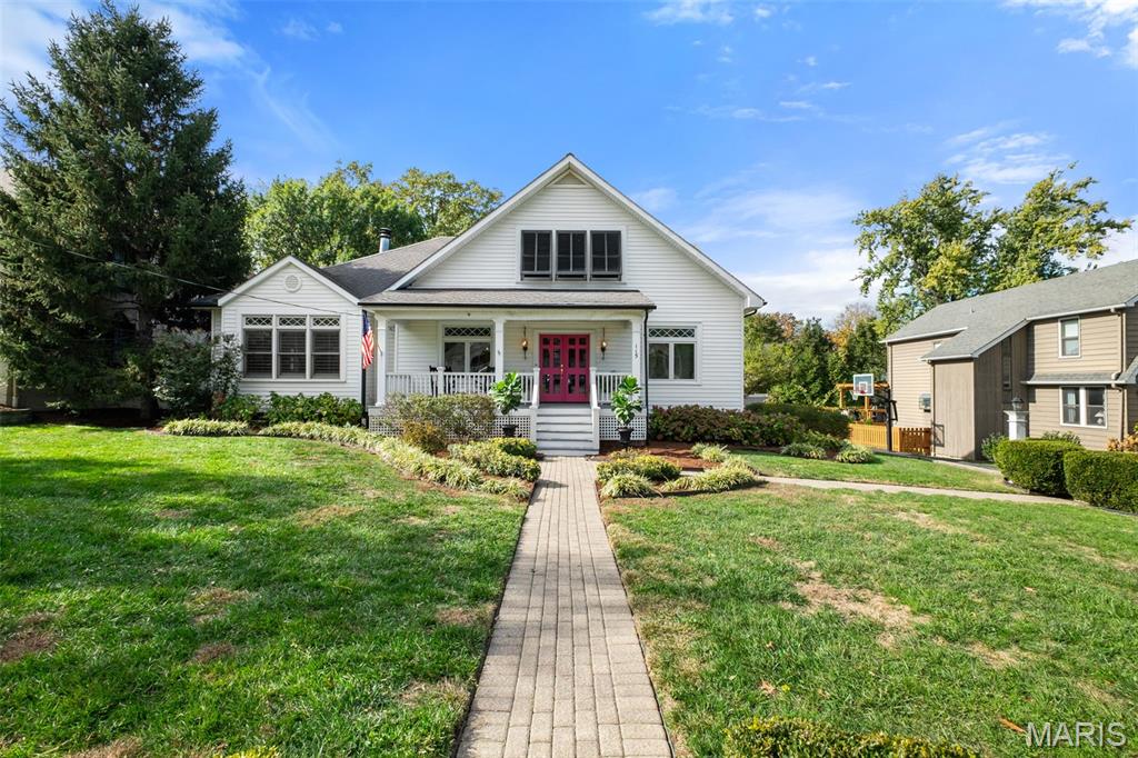 Showings begin Friday, November 14 at 9 a.m. by appointment only.  Photos will be uploaded on Tuesday afternoon.  Welcome to this beautiful Southern-style home featuring a wide front porch, double entry doors, and a beautifully landscaped yard that invites you to linger. Step inside the spacious foyer designed to warmly greet guests. Just off the entry, a charming living room serves perfectly as a sitting room, reading nook, or home office.  Beyond the living room, the expansive family room offers the ideal gathering space with hardwood floors, plantation shutters, a handsome fireplace, and walls of sun-filled windows that fill the room with warm, natural light — making this Southern home a dream. You will immediately notice the graceful tall ceilings that create an airy, inviting feel throughout the home. The adjoining dining room provides an intimate setting for family dinners and special celebrations.  The kitchen is a true highlight, boasting large picturesque windows overlooking the backyard, white cabinetry, a generous island, and a walk-in pantry. An inviting breakfast area and comfortable sitting space make this the heart of the home.  Three spacious bedrooms and two full baths complete the first floor, providing flexibility for family and guests alike. This home also offers an abundance of closets and storage throughout — a rare and welcome feature for any busy household.  Upstairs, the primary suite feels like a retreat, featuring vaulted ceilings, two large walk-in closets, and a lovely bath with double sinks, a soaking tub, and a separate shower. An additional bedroom with vaulted ceiling and a large attic space for storage round out the upper level.
Step outside to the back patio just off the kitchen, ideal for family barbecues and quiet evenings overlooking the beautiful back yard.  Located in one of Glendale’s most walkable neighborhoods, this home offers a true sense of community and convenience. Kids can easily walk or bike to school, stop by local favorites like Hanneke’s or the Glendale Grind, and enjoy nearby parks and golf clubs. It’s the perfect blend of Southern charm, modern comfort, and the friendly Glendale lifestyle.