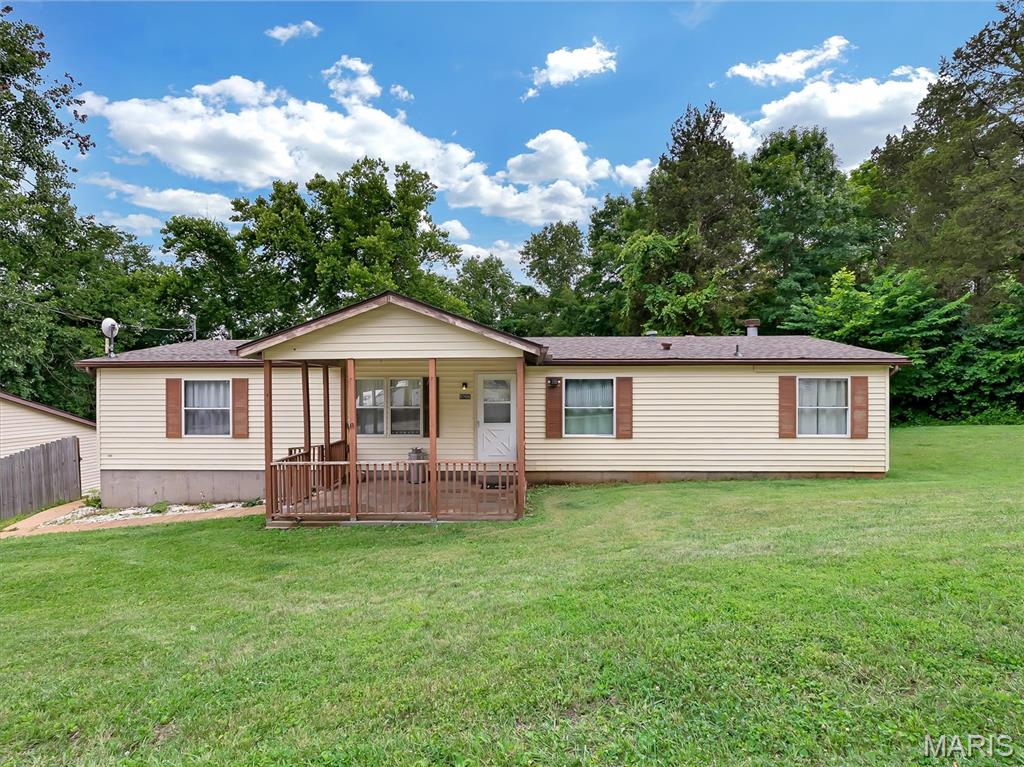Spacious three-bedroom, two-bath home situated on two private acres. This home is on a quiet street with a welcoming front porch and features ample storage, large kitchen, and separate dining room. The family room has a wood-burning fireplace. Enjoy outdoor living in your private, backyard, a bonus oversized garage with plenty of room for storage, a workshop, or hobby area, plus extra space for your toys and equipment. Ideally located with easy access to the river; property is not in a flood zone. Recent improvements include roof (2 years old), dishwasher, hot water heater, air conditioning unit.(5 years old), newer stainless steel stove. Convenient access to Highway 30.